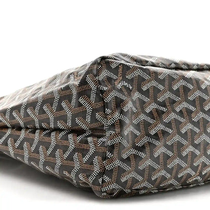 Hobo bag in black and gold canvas with repeating pattern and top fold