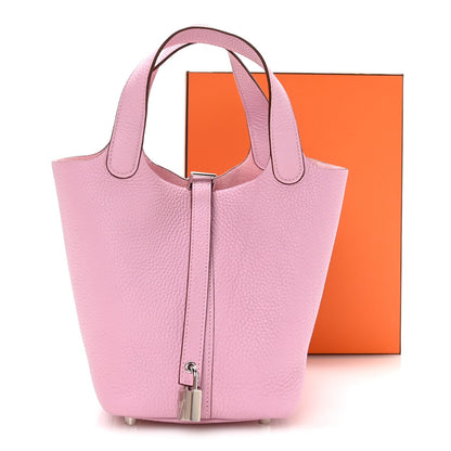Rose Sakura pink pebbled leather tote handbag with two handles and metal lock strap
