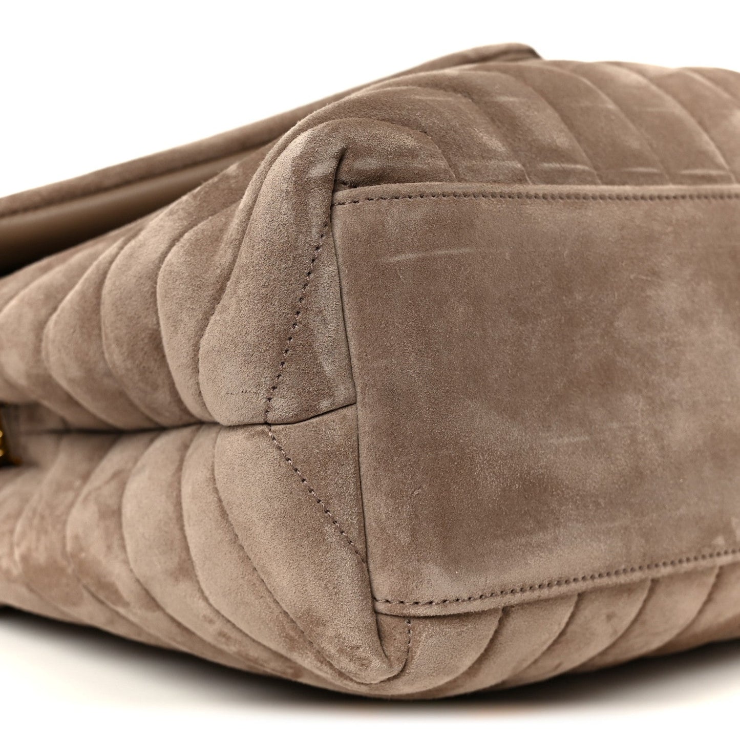 Taupe suede quilted satchel corner with stitched seam detail