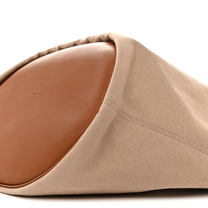 Desert dust canvas tote with brown leather-lined interior and stitched edge