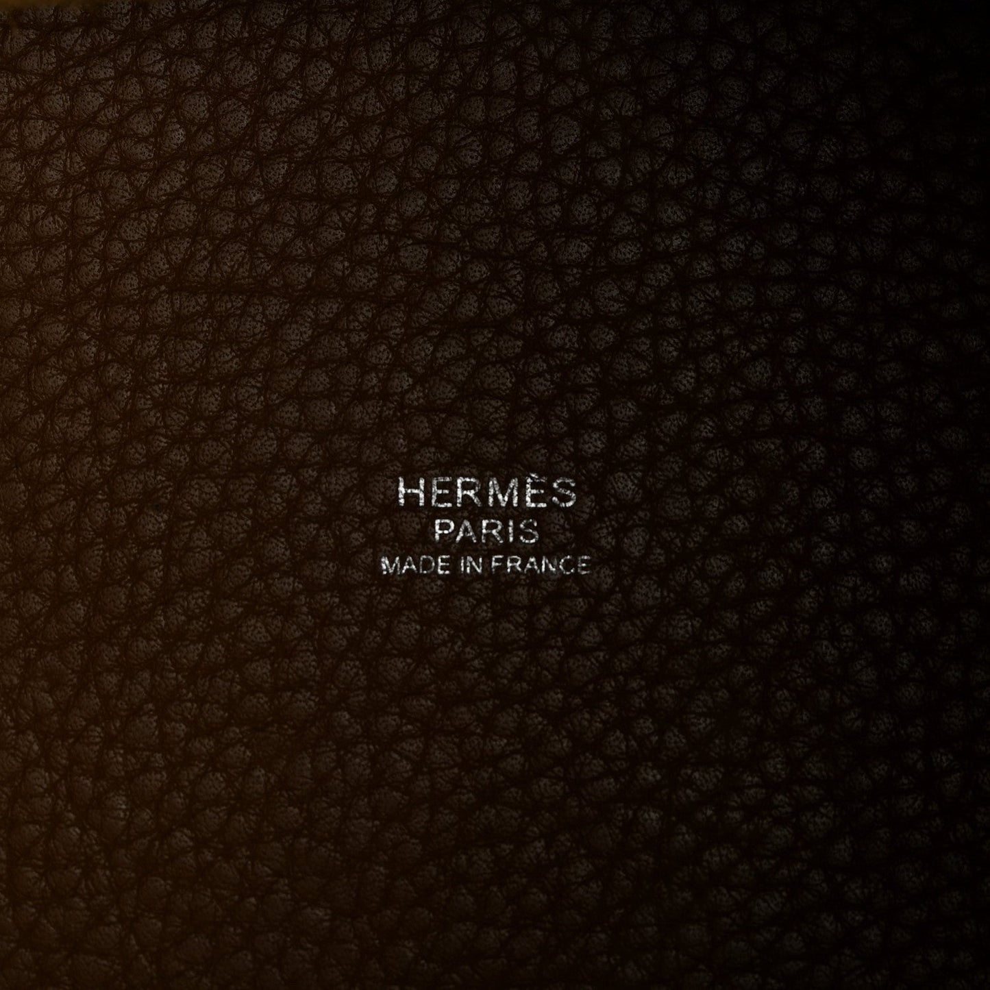 HERMÈS PARIS leather texture with “Made in France” stamp