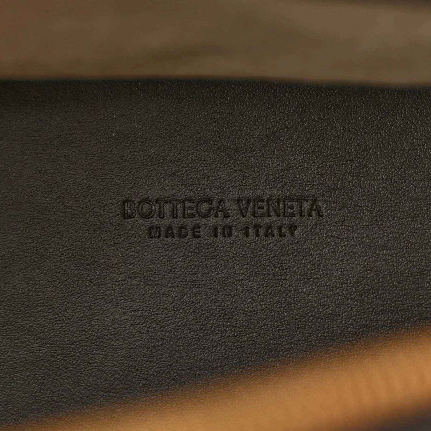 Bottega Veneta embossed on black leather weekender bag lining