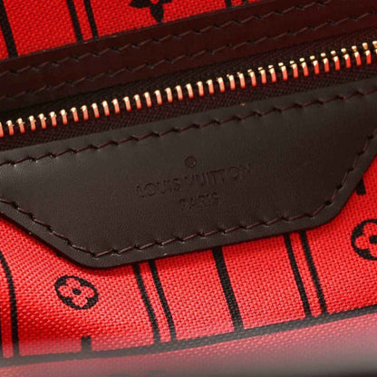 Damier Ebene tote bag interior zip pocket with stitched leather trim and logo mark