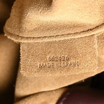 Loewe dark burgundy leather clutch interior stamp and stitching