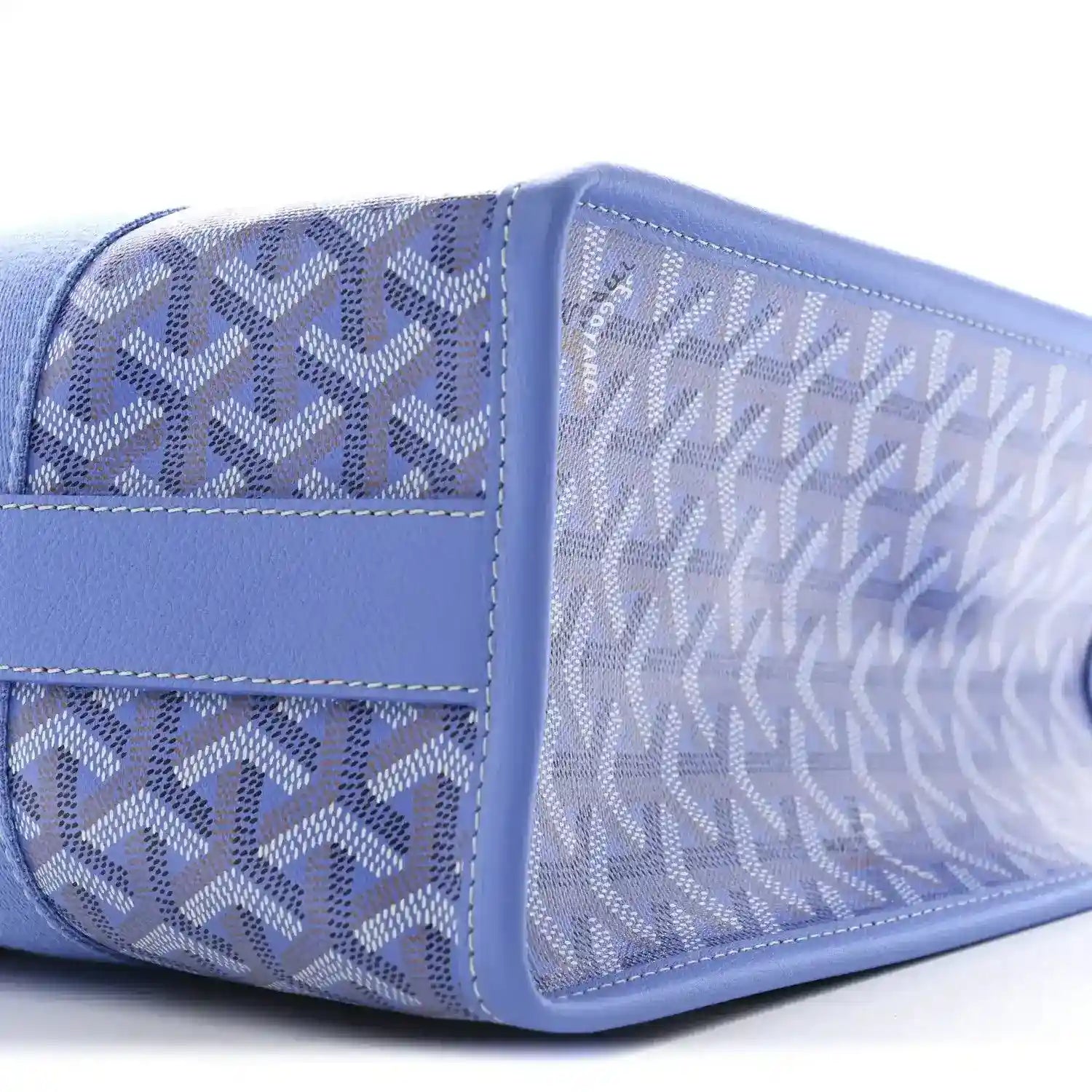 Close-up of Goyardine Villette PM tote bag side panel in blue coated canvas