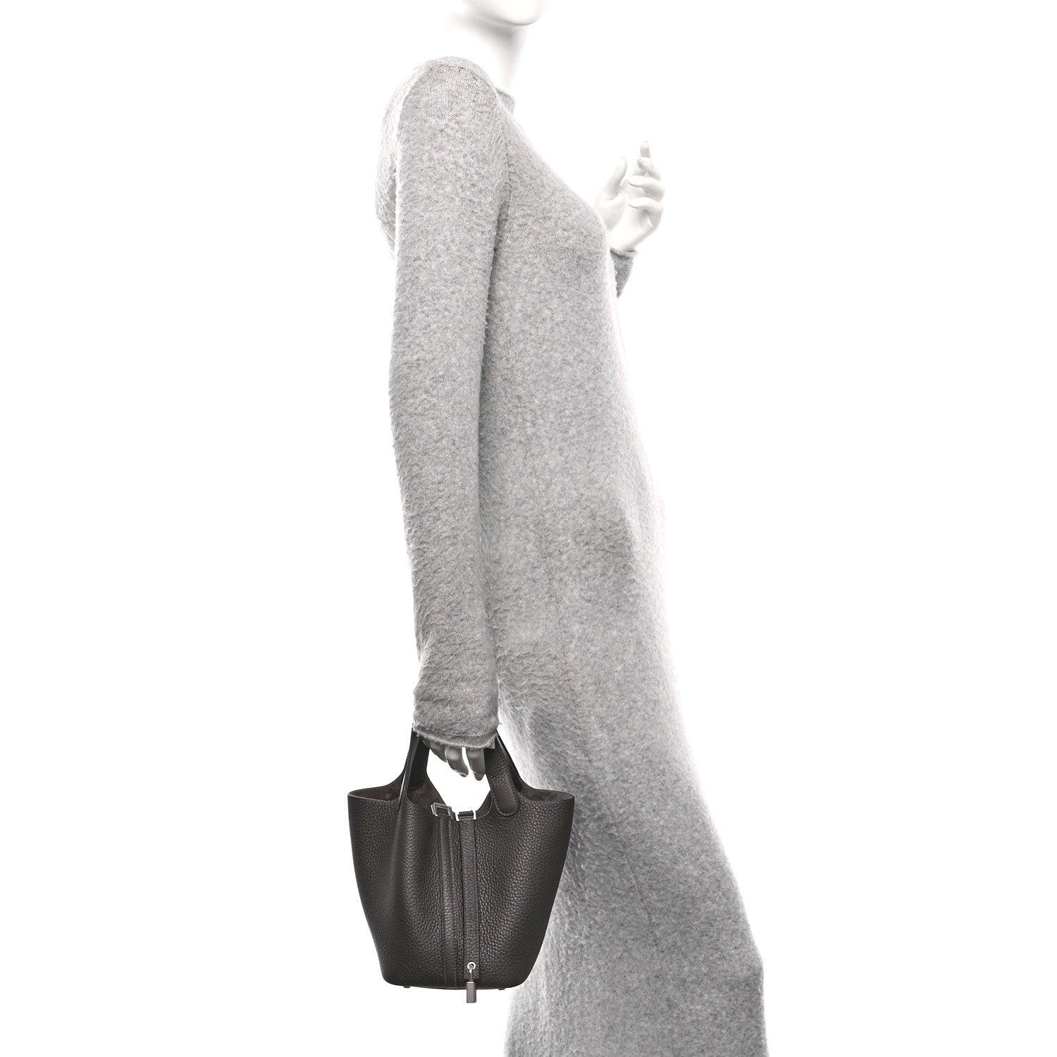 Dark brown leather tote bag with top handles and front lock closure, side view