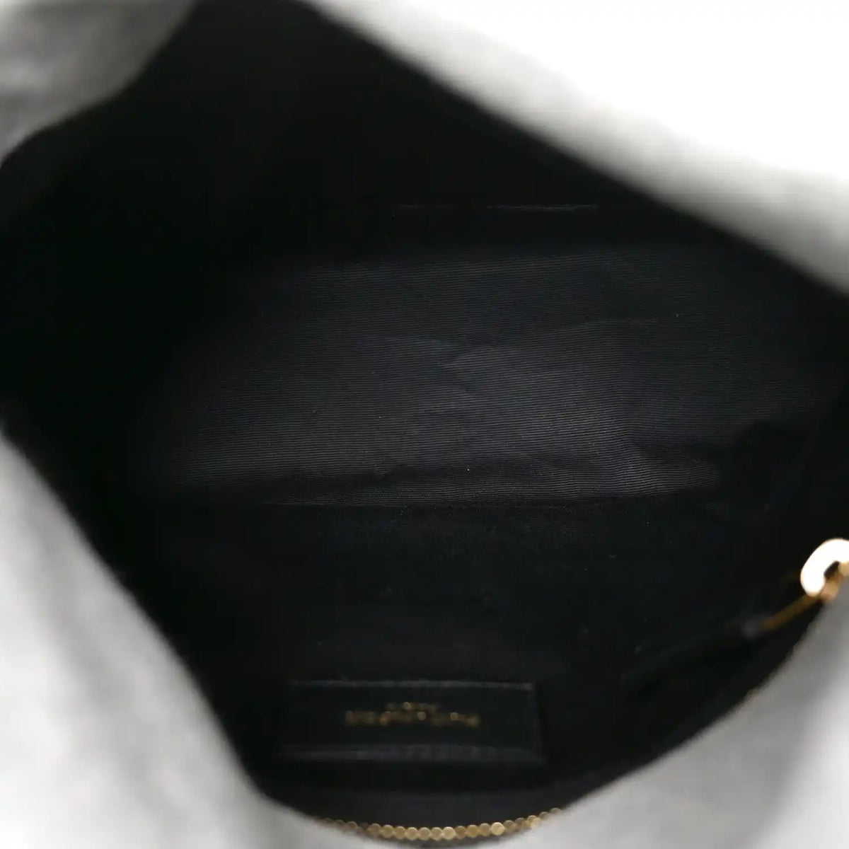 Saint Laurent Loulou satchel interior lining with zipper and fabric pocket.
