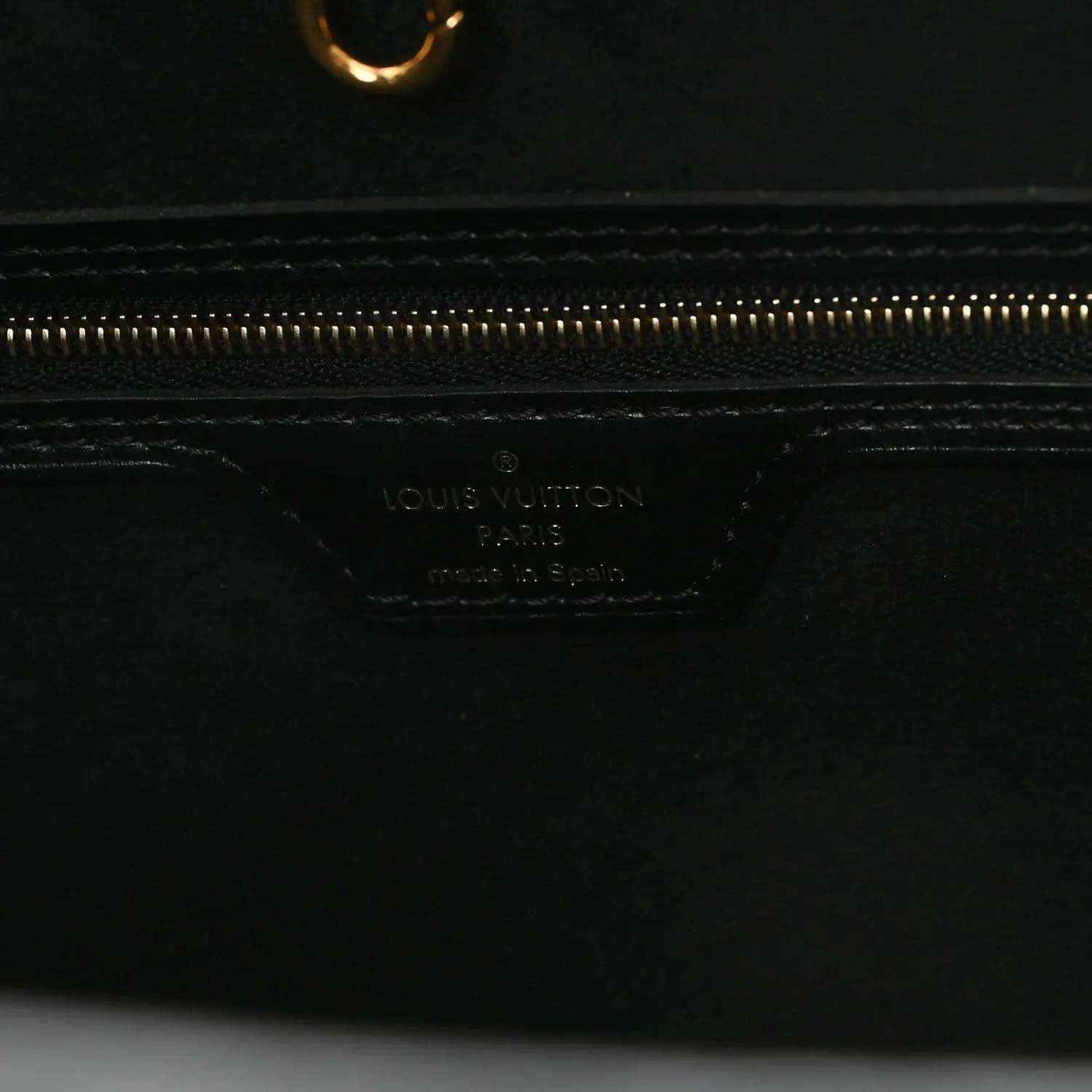 Black leather pouch base with Louis Vuitton logo stamp and gold zipper track