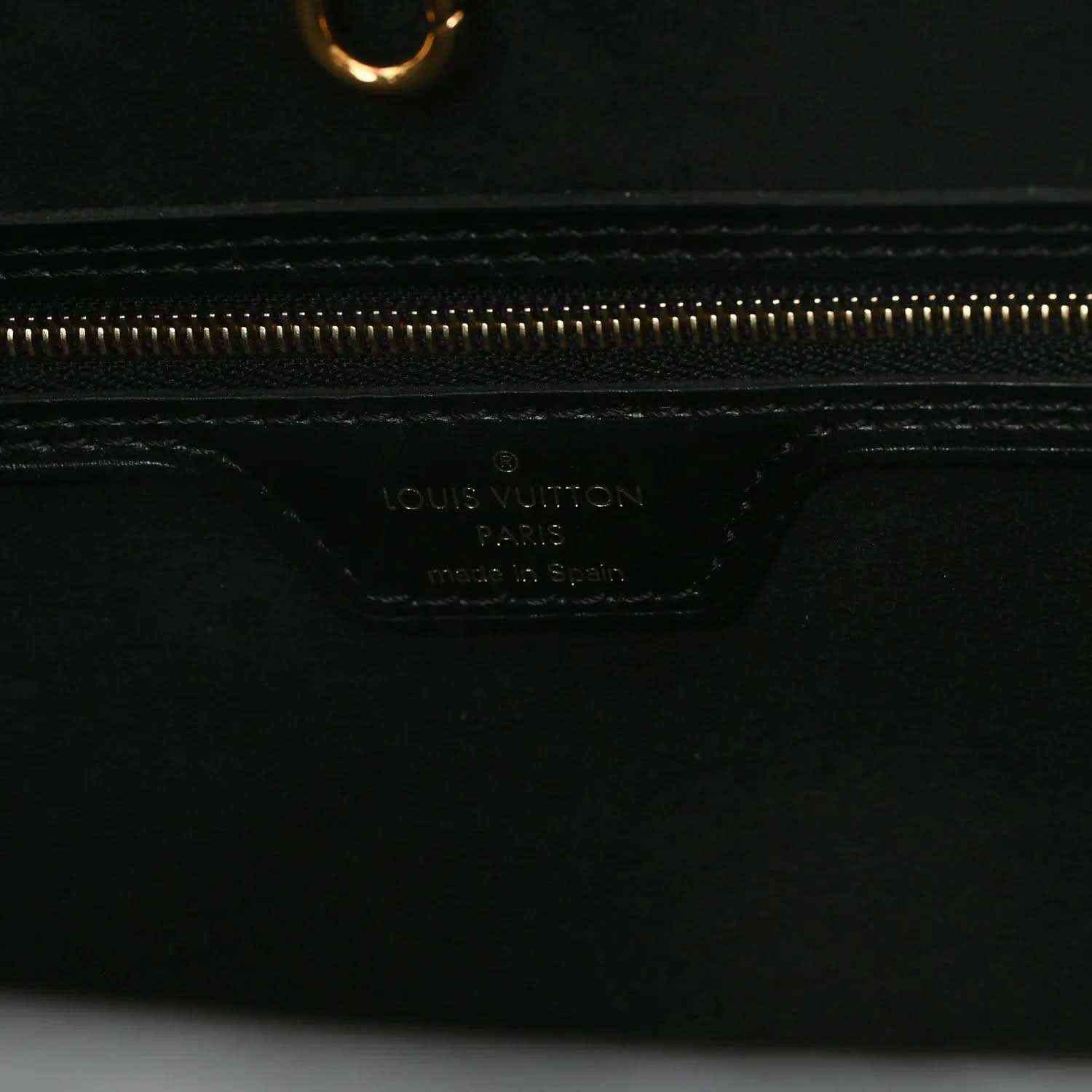 Black leather pouch base with Louis Vuitton logo stamp and gold zipper track