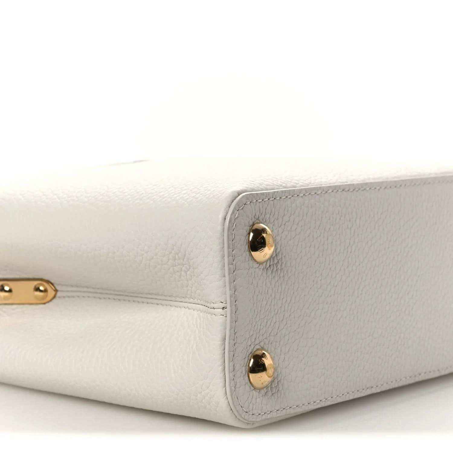 Louis Vuitton Capucines BB leather handbag side view with gold-tone studs