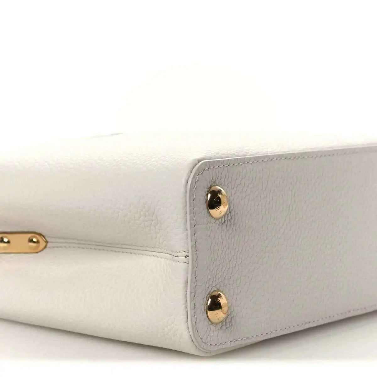 Louis Vuitton Capucines BB leather handbag side view with gold-tone studs
