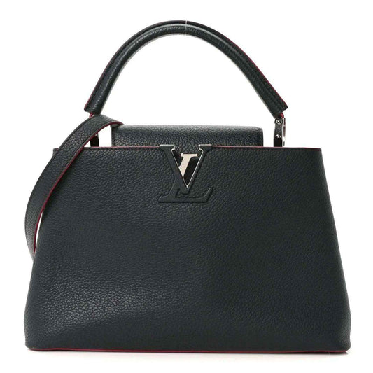 Louis Vuitton Capucines PM leather bag front, dark blue with fuchsia piping and LV emblem