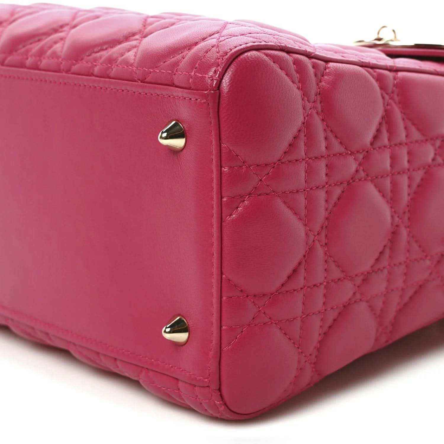 Fuchsia quilted leather handbag with gold-tone corner studs and back panel