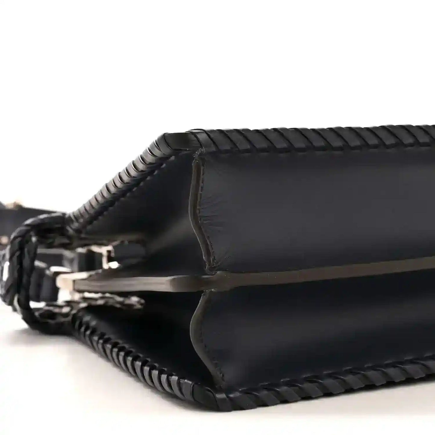 Nappa satchel side view with leather trim and braided crossbody strap