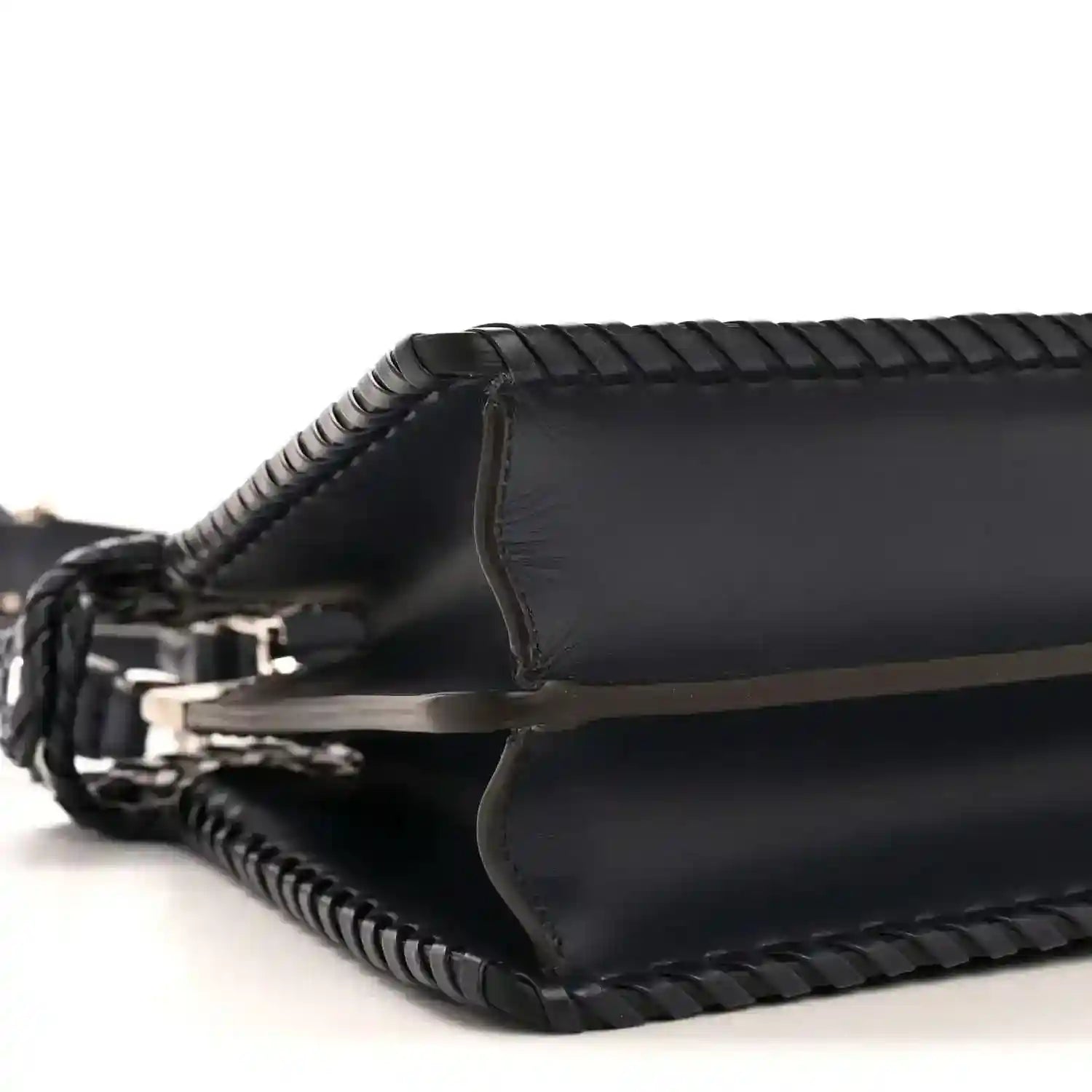 Nappa satchel side view with leather trim and braided crossbody strap