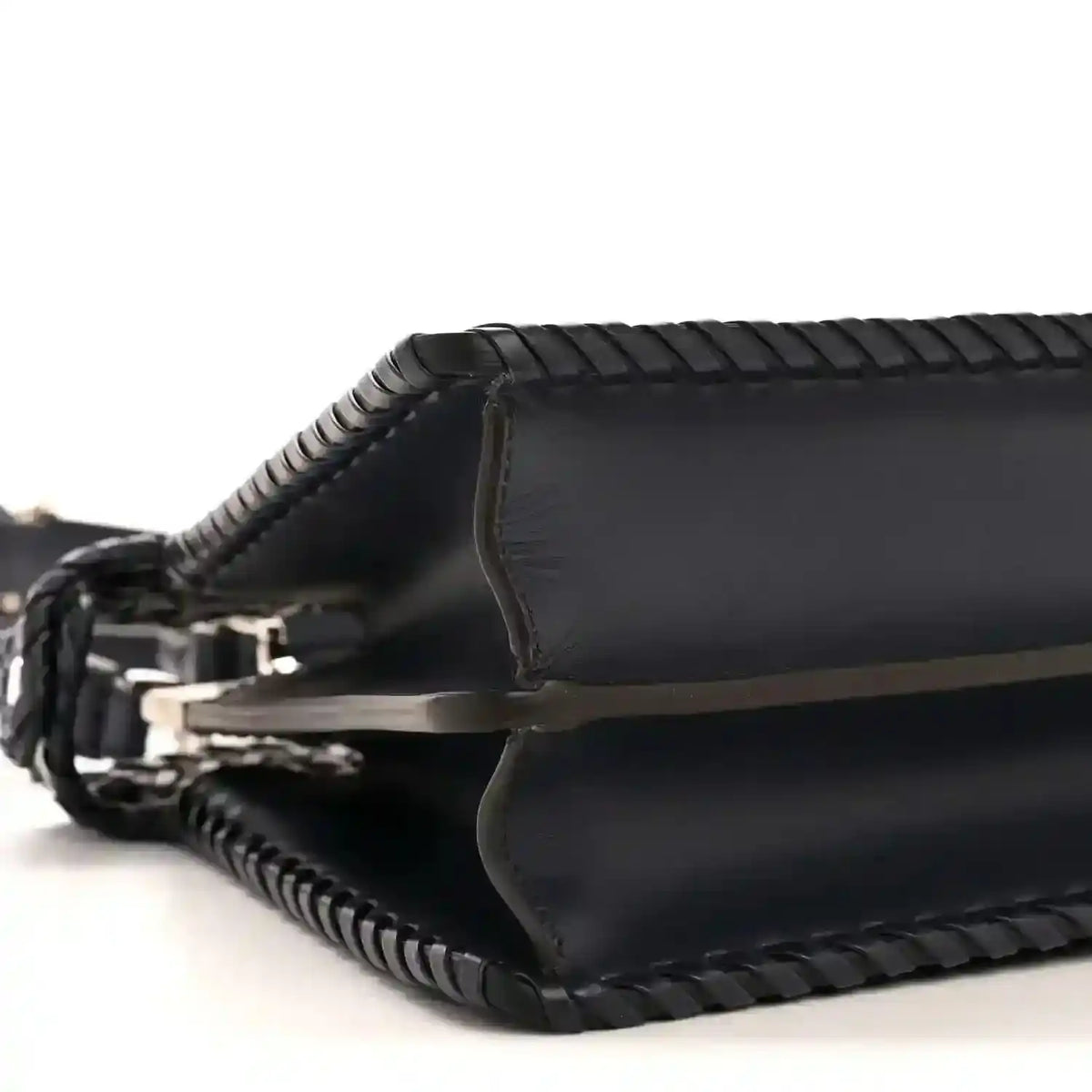 Nappa satchel side view with leather trim and braided crossbody strap