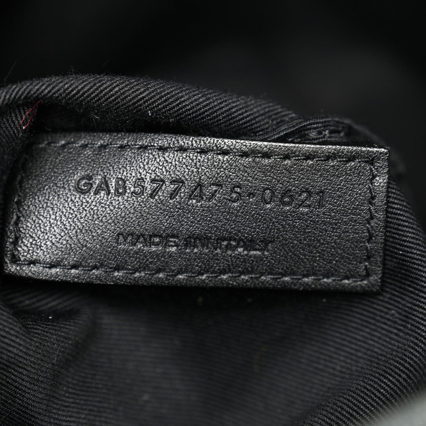 Leather size tag inside denim satchel with stamped numbers
