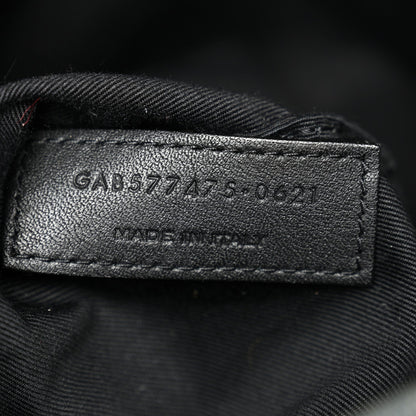 Leather size tag inside denim satchel with stamped numbers