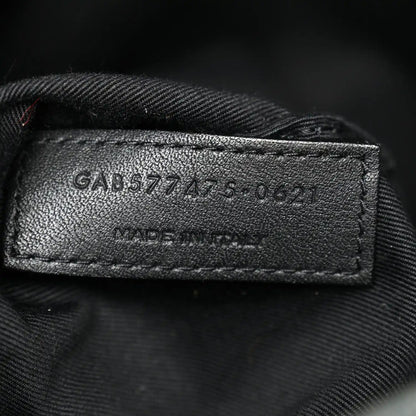 Leather size tag inside denim satchel with stamped numbers