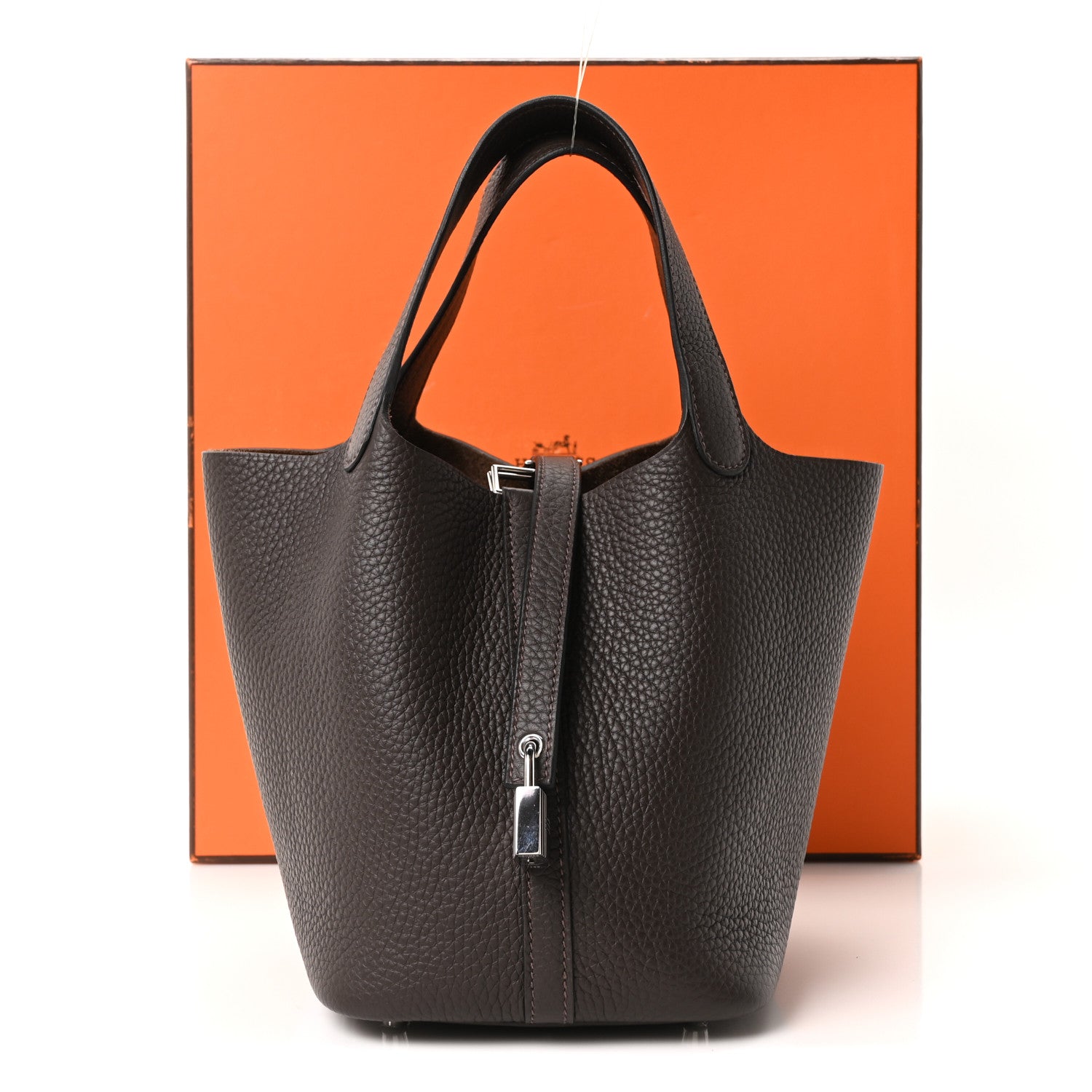 Dark brown leather tote bag with textured finish, top handles, front lock closure.