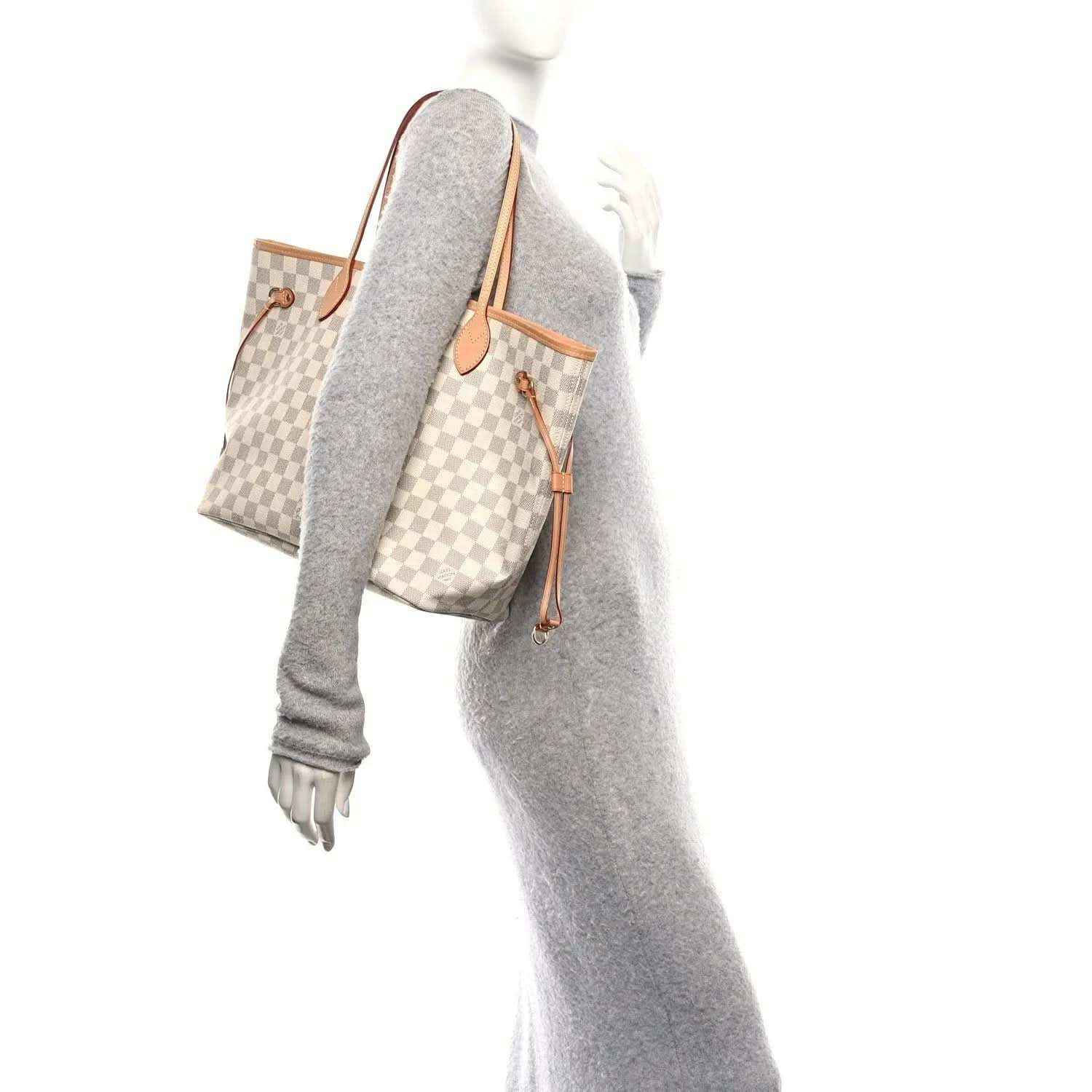 Damier Azur tote bag with tan leather trim, carried on shoulder