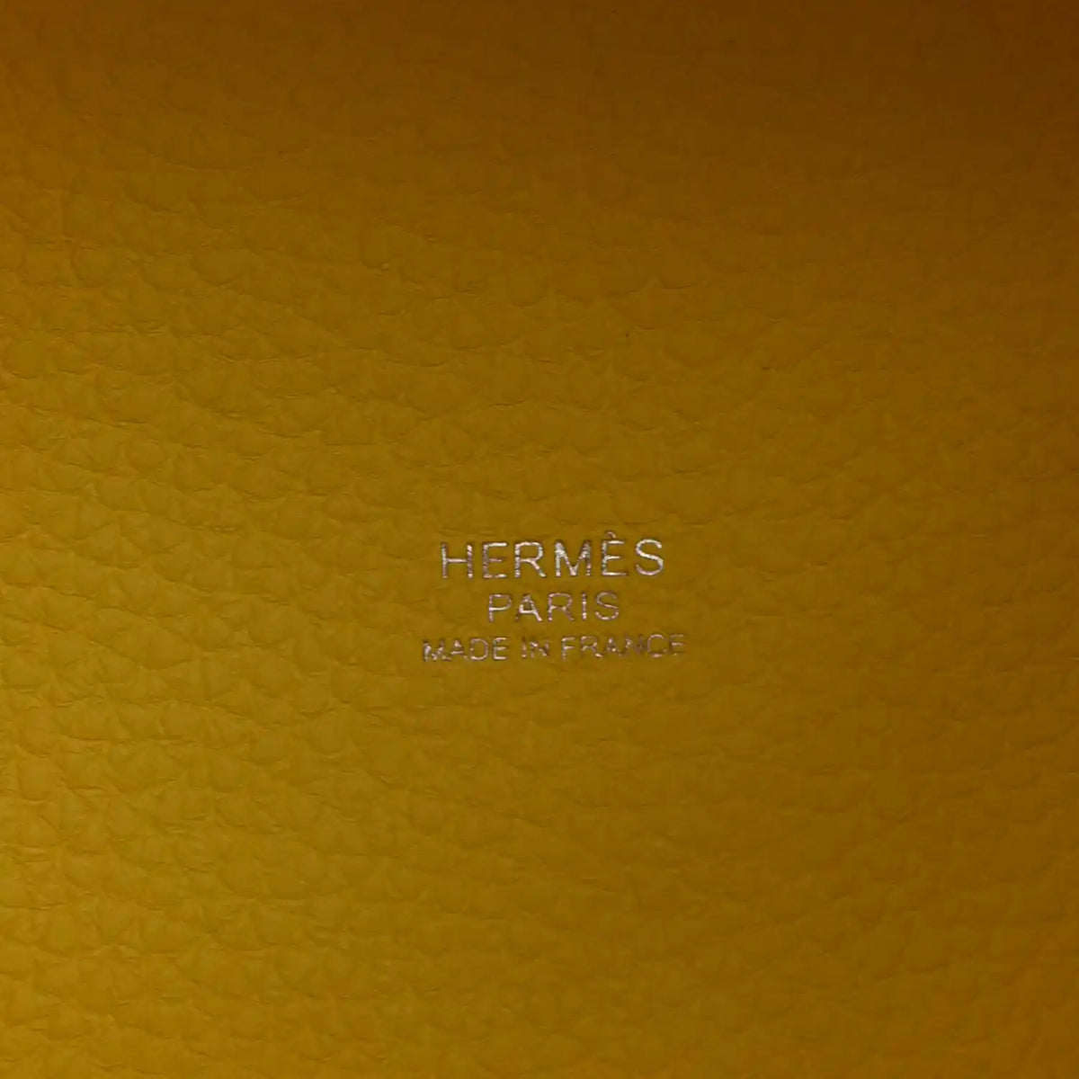 Hermes Paris stamp and Made in France on lime leather