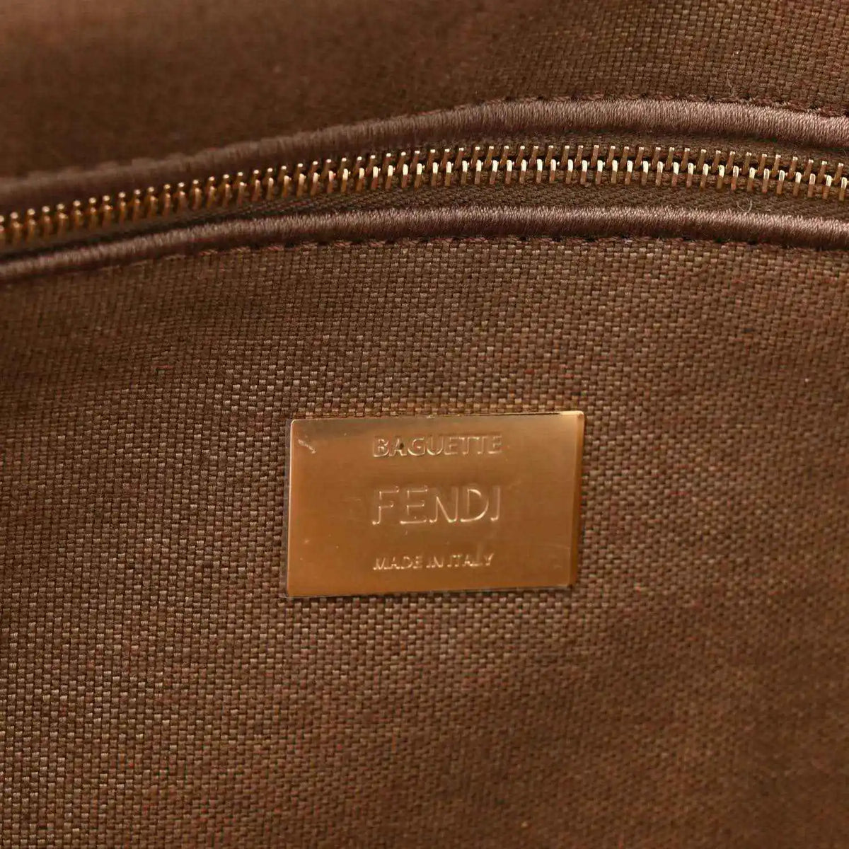 Fendi baguette shoulder bag inside view with zipper and embossed FENDI label