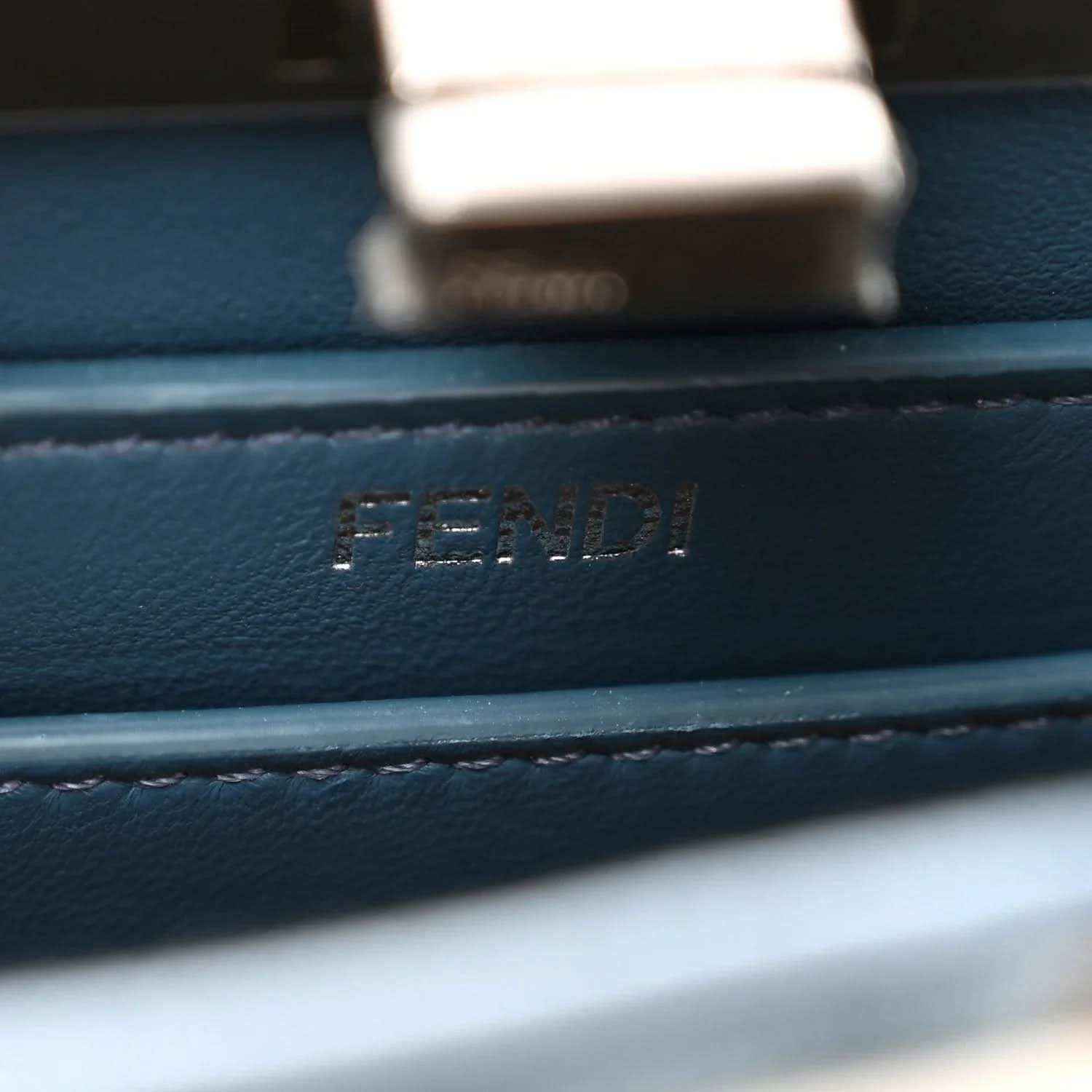 FENDI logo embossed on blue leather trim