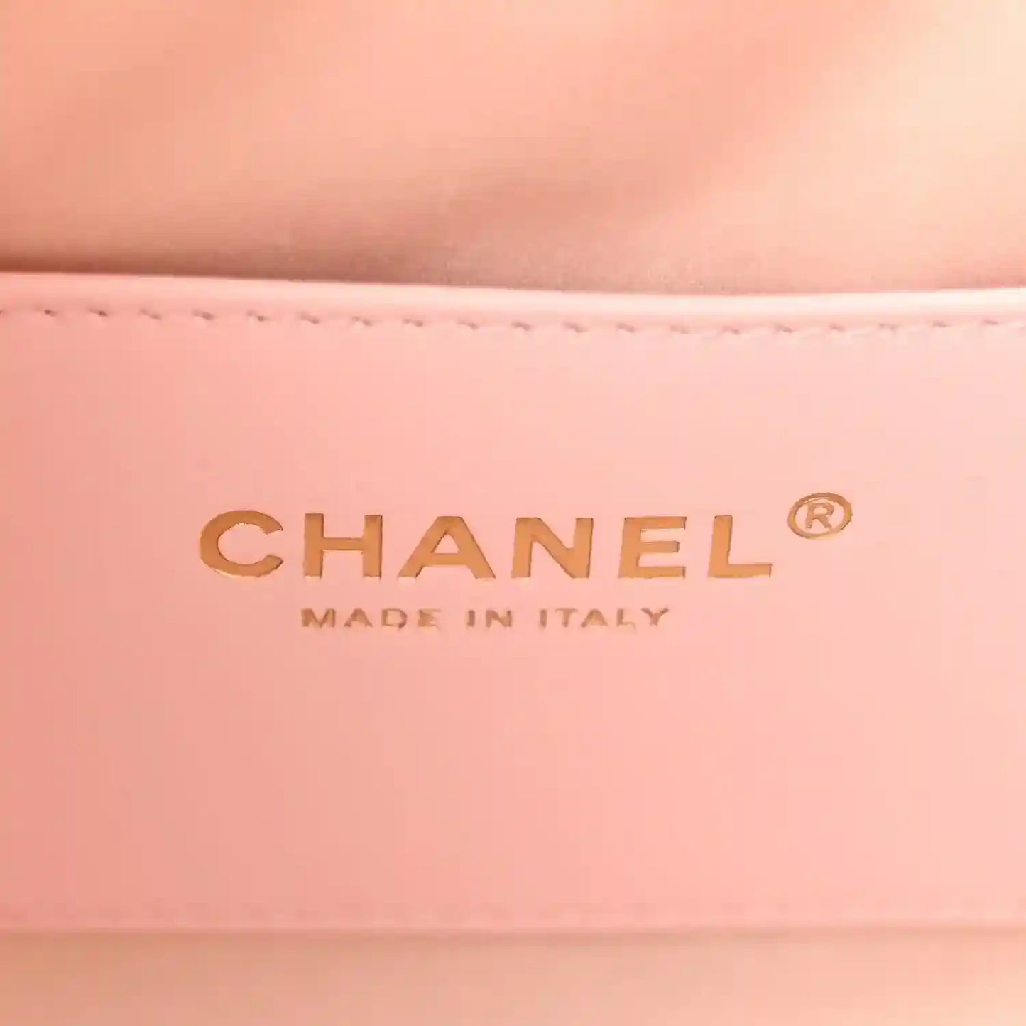 Chanel MADE IN ITALY logo on light pink leather interior panel