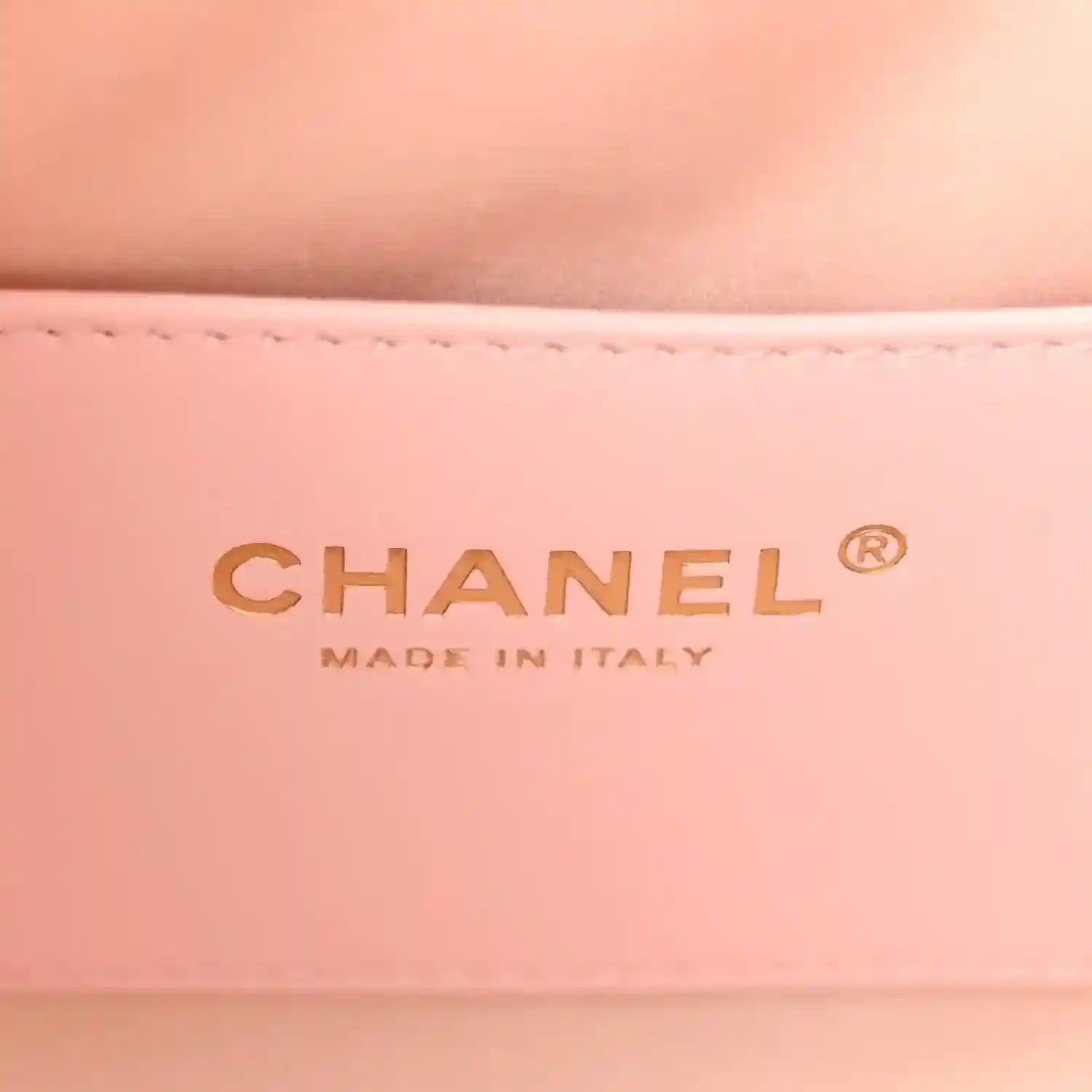 Chanel MADE IN ITALY logo on light pink leather interior panel