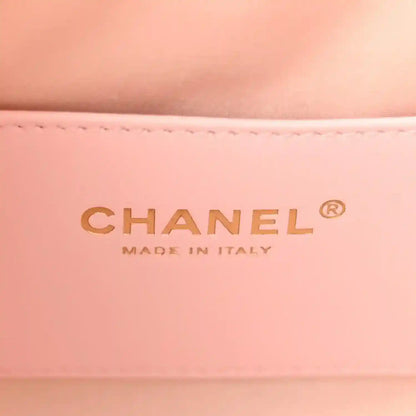 Chanel MADE IN ITALY logo on light pink leather interior panel