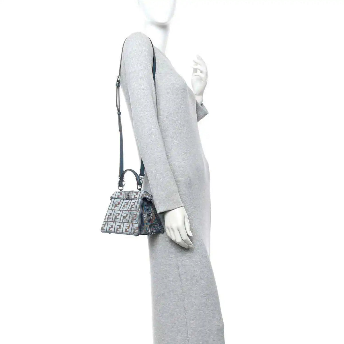 Small jacquard satchel worn crossbody, blue velvet with tan FF pattern and shoulder strap