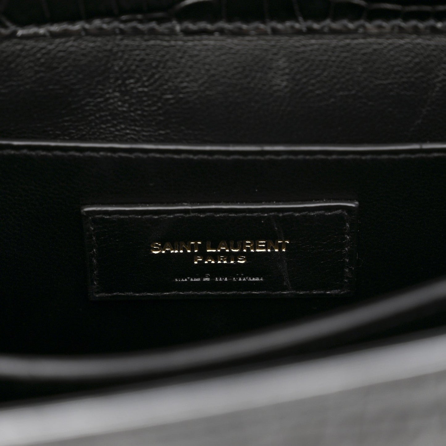 Black leather interior label reading SAINT LAURENT PARIS