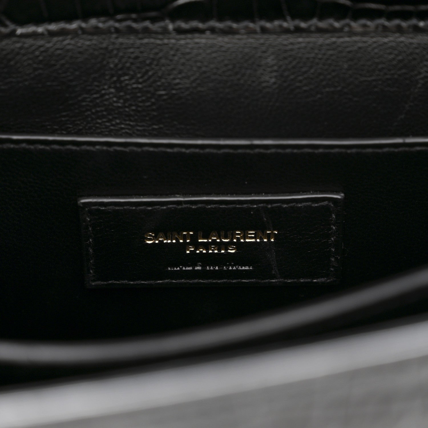 Black leather interior label reading SAINT LAURENT PARIS