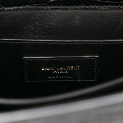 Black leather interior label reading SAINT LAURENT PARIS