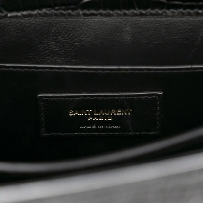 Black leather interior label reading SAINT LAURENT PARIS