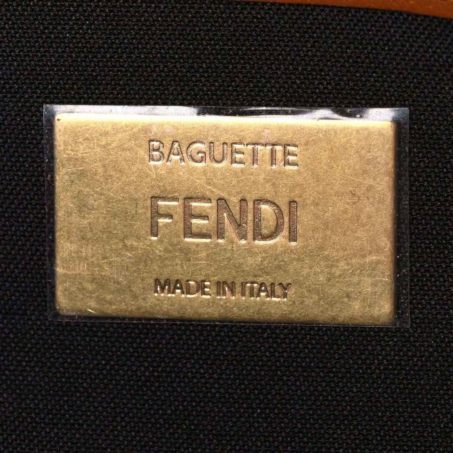 Fendi baguette bag leather label reading "BAGUETTE" and "FENDI"