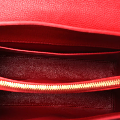 Celine red leather interior with stitched lining and zipper edge.