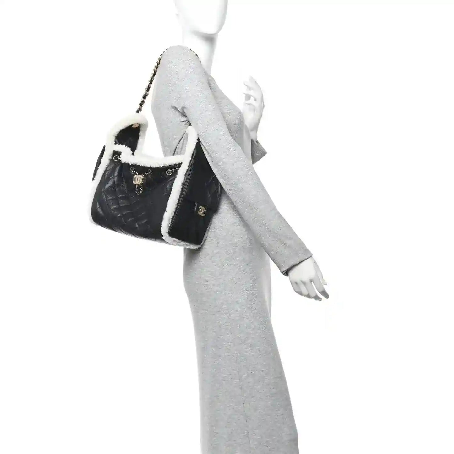 Small Chanel quilted handbag in black with white shearling trim and chain strap