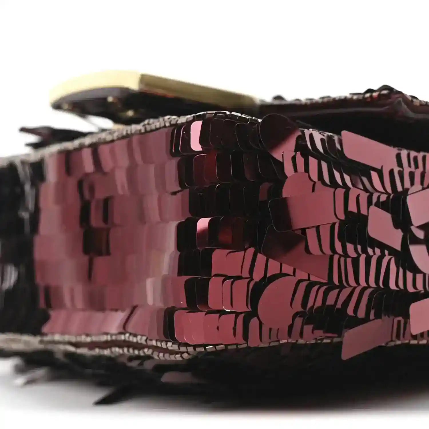 Mini baguette handbag close-up showing red sequin pattern and dark trim edge