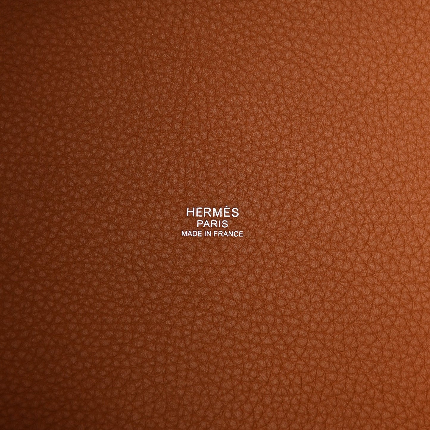 Tan leather lining with printed HERMÈS PARIS MADE IN FRANCE text