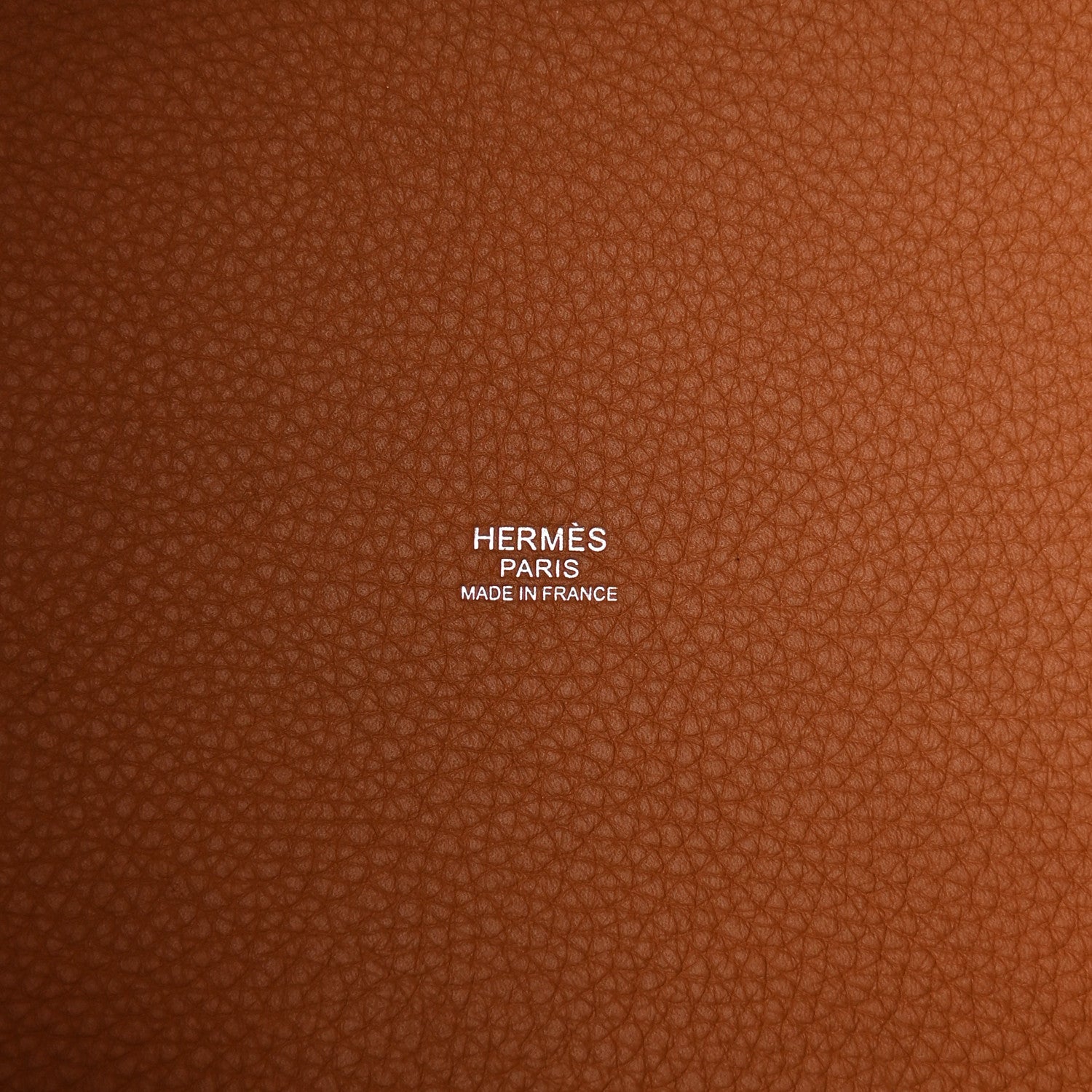 Tan leather lining with printed HERMÈS PARIS MADE IN FRANCE text