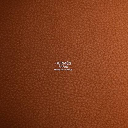Tan leather lining with printed HERMÈS PARIS MADE IN FRANCE text