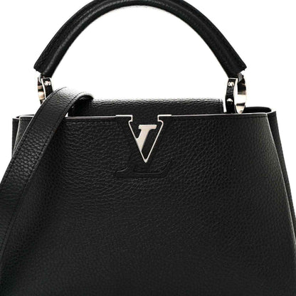 Black leather handbag with LV emblem on front and top handle