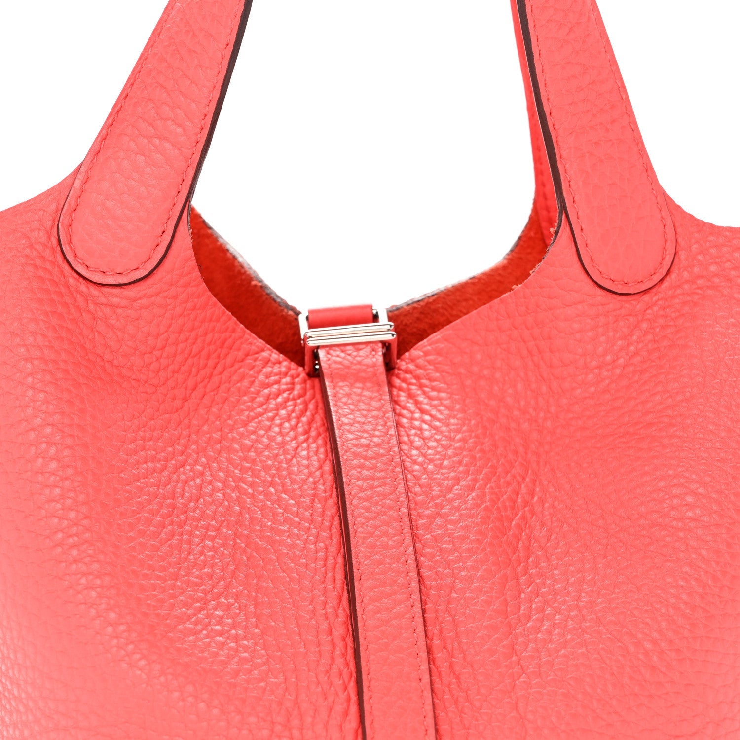 Rose pink leather tote with top clasp hardware at center seam