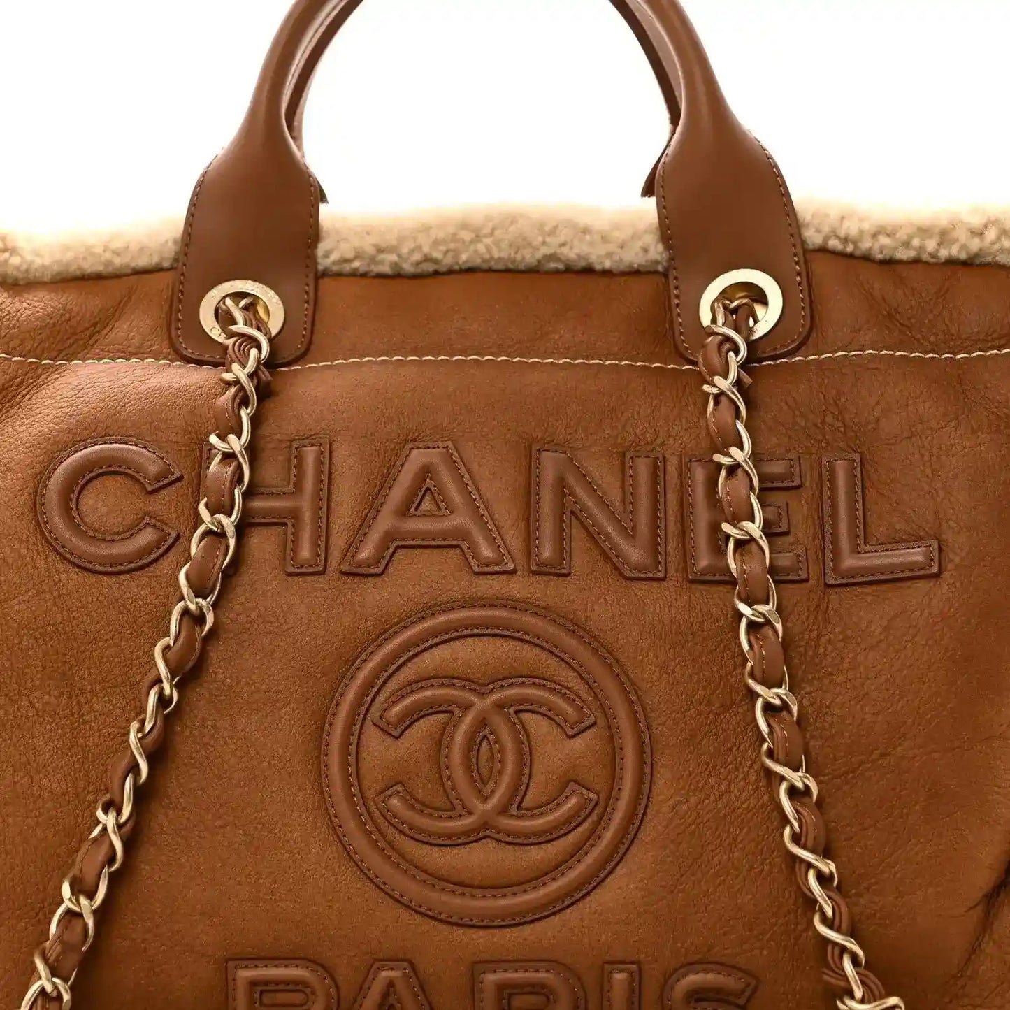 Chanel tote bag front with brown lambskin, chain handles, and shearling top trim