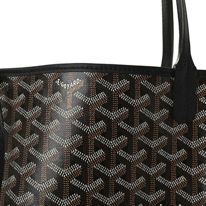 Goyardine tote bag fabric with monogram pattern and black leather strap detail