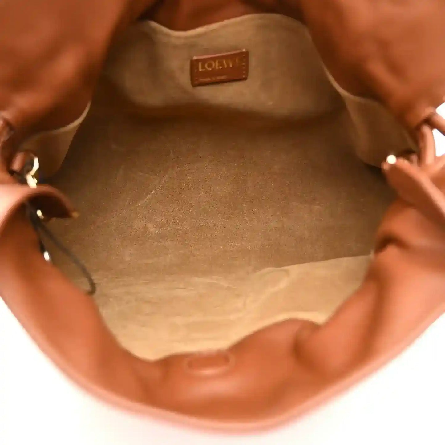 Flamenco knot clutch interior lining with Loewe leather logo patch at top