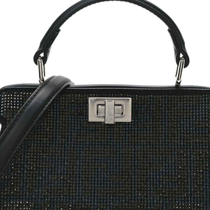 Black crystal satchel front with silver-tone geometric clasp and top handles