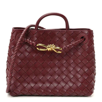Small intrecciato nappa leather shoulder bag, burgundy, top handles and gold clasp.
